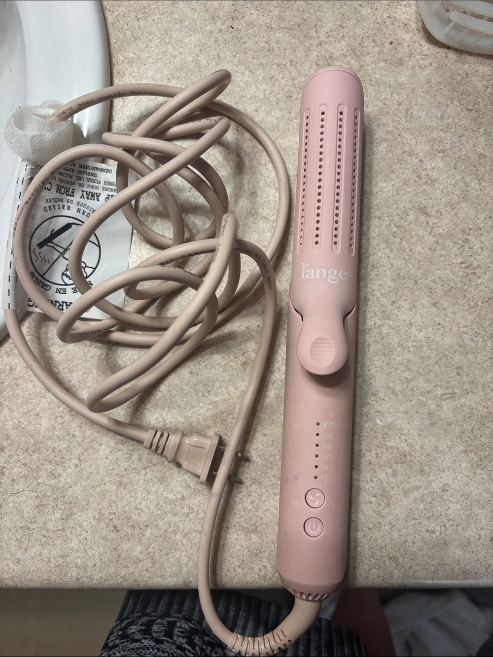 Hair styling tool with power cord